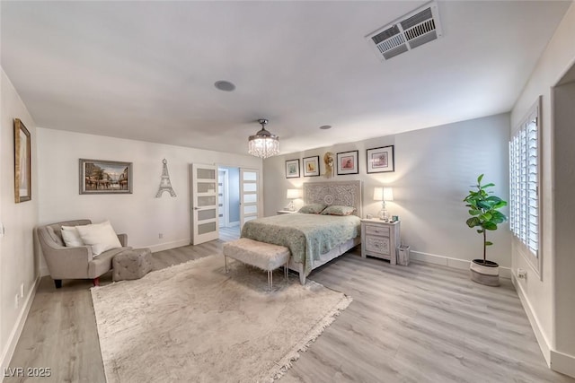 895 Beartooth Falls Ct, Henderson, NV 89052 - bedroom featuring light wood finished floors, multiple windows, and a chandelier