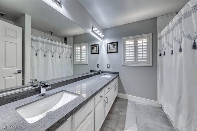895 Beartooth Falls Ct, Henderson, NV 89052 - bathroom with double vanity, a shower with curtain, and marble finish floors
