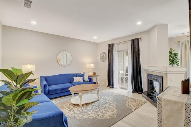 9000 Las Vegas Blvd Unit 2060, Las Vegas, NV 89123 - living room with a tile fireplace, light wood-type flooring, and recessed lighting