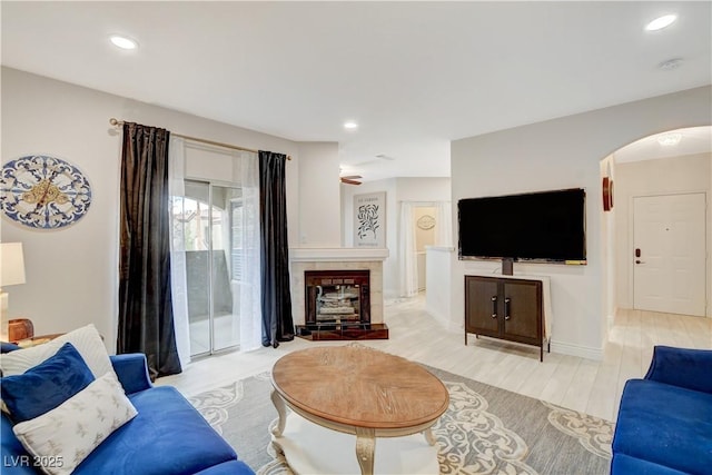9000 Las Vegas Blvd Unit 2060, Las Vegas, NV 89123 - living area with arched walkways, light wood-style flooring, a glass covered fireplace, and recessed lighting