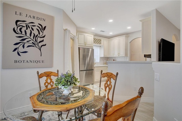 9000 Las Vegas Blvd Unit 2060, Las Vegas, NV 89123 - dining room featuring arched walkways, recessed lighting, and light wood finished floors