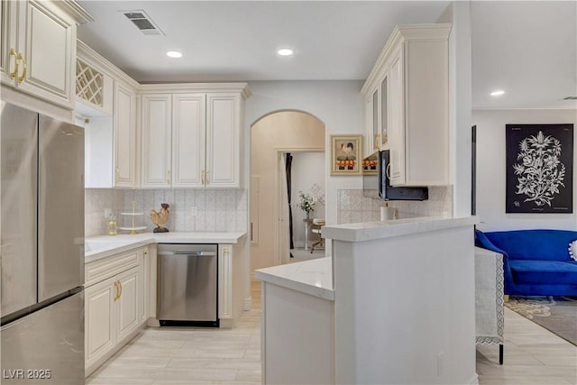 9000 Las Vegas Blvd Unit 2060, Las Vegas, NV 89123 - kitchen featuring stainless steel appliances, arched walkways, decorative backsplash, recessed lighting, and light wood finished floors