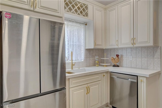 9000 Las Vegas Blvd Unit 2060, Las Vegas, NV 89123 - kitchen featuring appliances with stainless steel finishes, backsplash, light countertops, and cream cabinets