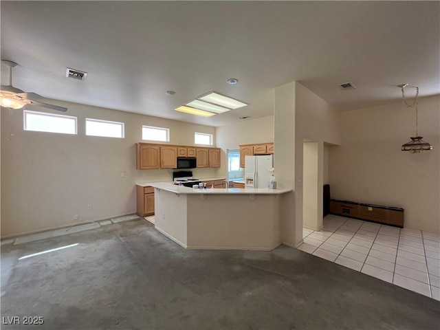 2712 Breakers Creek Dr, Las Vegas, NV 89134 - kitchen featuring white fridge with ice dispenser, black microwave, ceiling fan, a peninsula, and range