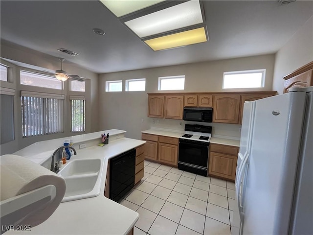 2712 Breakers Creek Dr, Las Vegas, NV 89134 - kitchen with black appliances, light tile patterned floors, light countertops, ceiling fan, and brown cabinetry