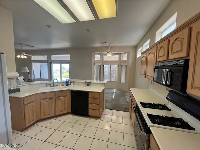 2712 Breakers Creek Dr, Las Vegas, NV 89134 - kitchen featuring black appliances, a ceiling fan, plenty of natural light, light countertops, and recessed lighting