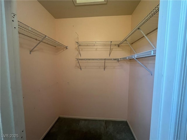 2712 Breakers Creek Dr, Las Vegas, NV 89134 - spacious closet featuring dark colored carpet