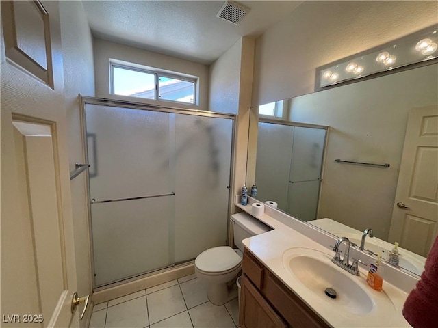 2712 Breakers Creek Dr, Las Vegas, NV 89134 - bathroom featuring a shower stall, tile patterned flooring, and vanity