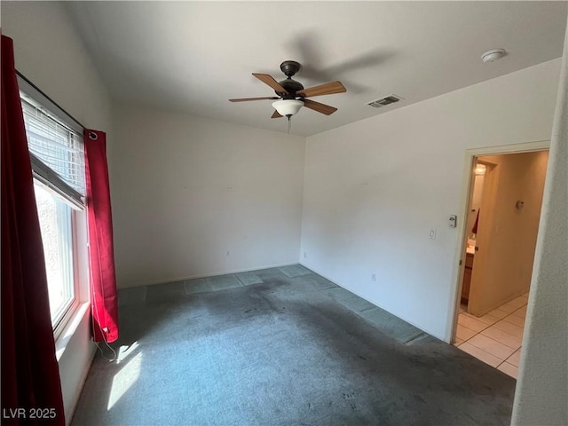 2712 Breakers Creek Dr, Las Vegas, NV 89134 - tiled spare room featuring ceiling fan and carpet