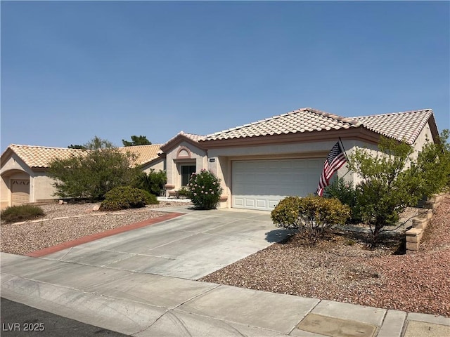 2712 Breakers Creek Dr, Las Vegas, NV 89134 - view of front of property featuring an attached garage, concrete driveway, a tiled roof, and stucco siding