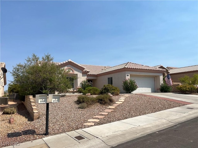 2712 Breakers Creek Dr, Las Vegas, NV 89134 - view of front facade featuring stucco siding, an attached garage, a tiled roof, and driveway