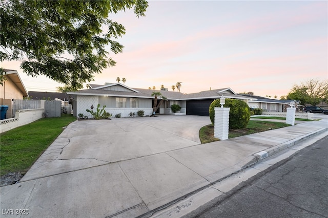 1009 Ironwood Dr, Las Vegas, NV 89108 - ranch-style house featuring driveway and an attached garage