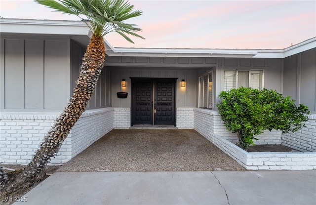 1009 Ironwood Dr, Las Vegas, NV 89108 - property entrance featuring board and batten siding and brick siding