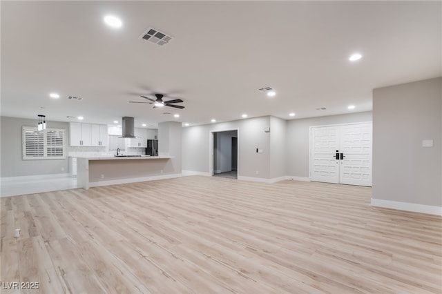 1009 Ironwood Dr, Las Vegas, NV 89108 - unfurnished living room featuring recessed lighting, light wood finished floors, and ceiling fan