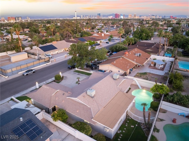 1009 Ironwood Dr, Las Vegas, NV 89108 - aerial view at dusk of view of pool and a skyline view