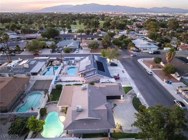1009 Ironwood Dr, Las Vegas, NV 89108 - aerial view of residential area featuring a pool area and a mountain backdrop