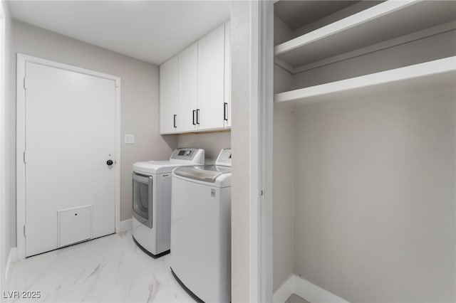 1009 Ironwood Dr, Las Vegas, NV 89108 - washroom with independent washer and dryer, cabinet space, and light marble finish floors