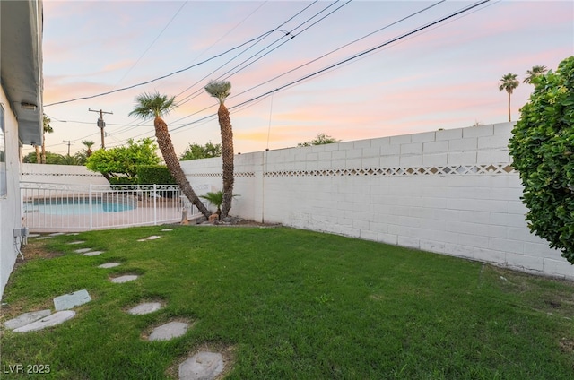 1009 Ironwood Dr, Las Vegas, NV 89108 - yard at dusk with a fenced backyard