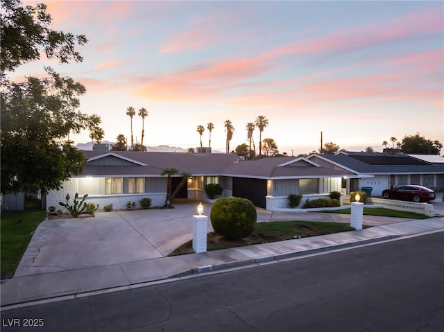 1009 Ironwood Dr, Las Vegas, NV 89108 - ranch-style home featuring driveway, an attached garage, and brick siding