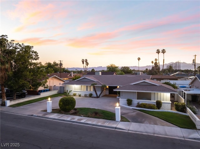 1009 Ironwood Dr, Las Vegas, NV 89108 - ranch-style house with curved driveway and a shingled roof