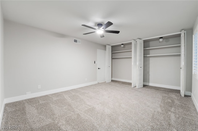 1009 Ironwood Dr, Las Vegas, NV 89108 - unfurnished bedroom featuring multiple closets, carpet, and a ceiling fan