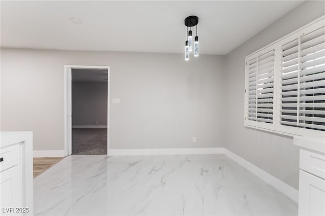 1009 Ironwood Dr, Las Vegas, NV 89108 - unfurnished dining area with light marble finish floors