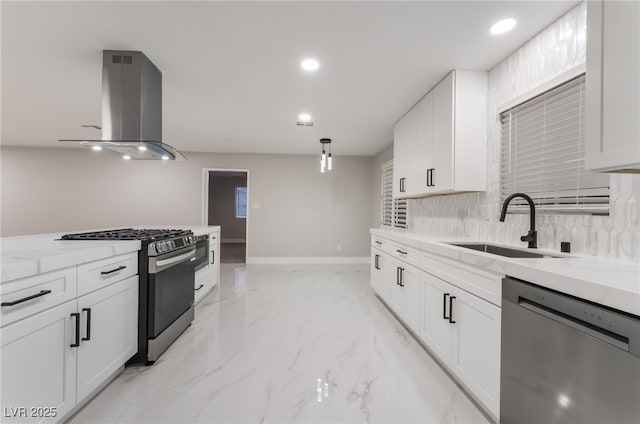1009 Ironwood Dr, Las Vegas, NV 89108 - kitchen featuring appliances with stainless steel finishes, island exhaust hood, light stone counters, white cabinets, and recessed lighting