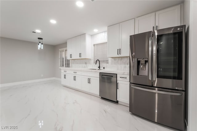 1009 Ironwood Dr, Las Vegas, NV 89108 - kitchen featuring appliances with stainless steel finishes, light countertops, white cabinetry, backsplash, and recessed lighting