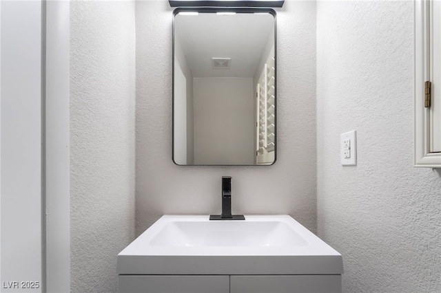 1009 Ironwood Dr, Las Vegas, NV 89108 - bathroom with a textured wall and vanity
