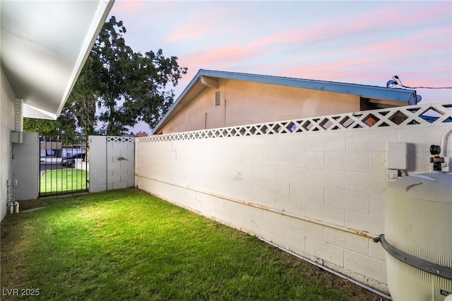 1009 Ironwood Dr, Las Vegas, NV 89108 - property exterior at dusk featuring a fenced backyard and stucco siding