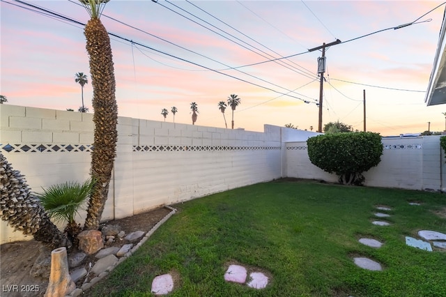 1009 Ironwood Dr, Las Vegas, NV 89108 - yard at dusk with a fenced backyard