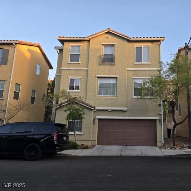 8949 Brian Christopher Ave, Las Vegas, NV 89149 - mediterranean / spanish house with a tiled roof, stucco siding, an attached garage, and driveway
