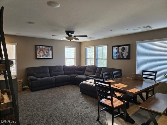 8949 Brian Christopher Ave, Las Vegas, NV 89149 - carpeted living area with a ceiling fan