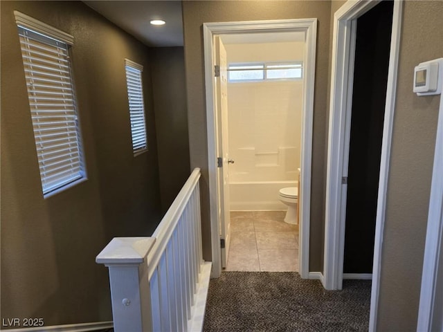8949 Brian Christopher Ave, Las Vegas, NV 89149 - hall featuring an upstairs landing and tile patterned flooring