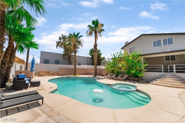 5676 Birchwood Cir, Las Vegas, NV 89120 - view of pool with a pool with connected hot tub, a patio, and a fenced backyard