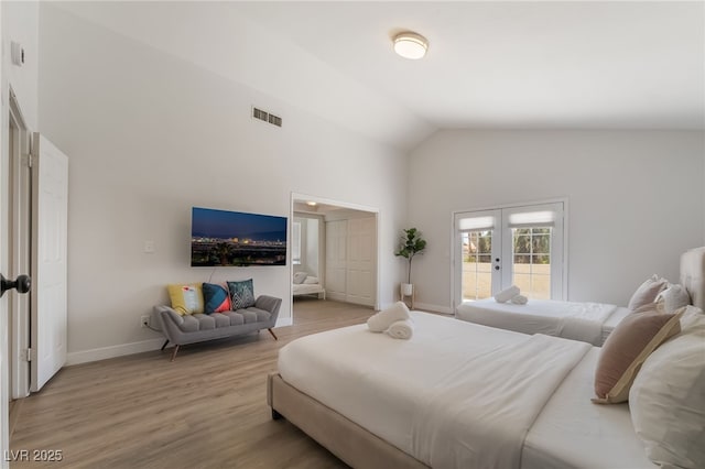 5676 Birchwood Cir, Las Vegas, NV 89120 - bedroom featuring french doors, high vaulted ceiling, light wood-style floors, and access to exterior