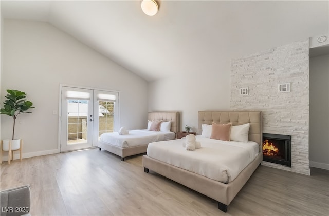 5676 Birchwood Cir, Las Vegas, NV 89120 - bedroom featuring access to outside, light wood-style floors, high vaulted ceiling, french doors, and a fireplace