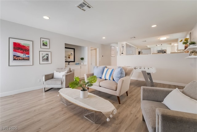 5676 Birchwood Cir, Las Vegas, NV 89120 - living area featuring light wood finished floors and recessed lighting