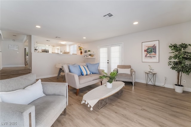 5676 Birchwood Cir, Las Vegas, NV 89120 - living room with light wood-style floors, french doors, and recessed lighting