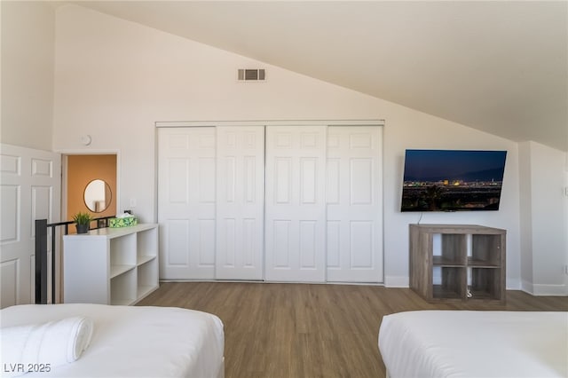 5676 Birchwood Cir, Las Vegas, NV 89120 - bedroom with vaulted ceiling, wood finished floors, and a closet