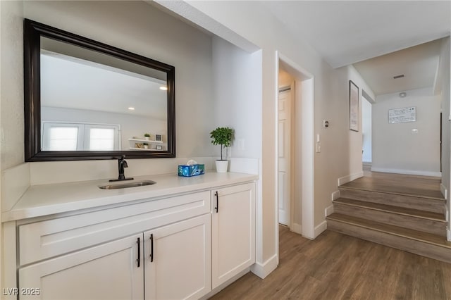 5676 Birchwood Cir, Las Vegas, NV 89120 - hallway featuring light wood-style flooring and stairway