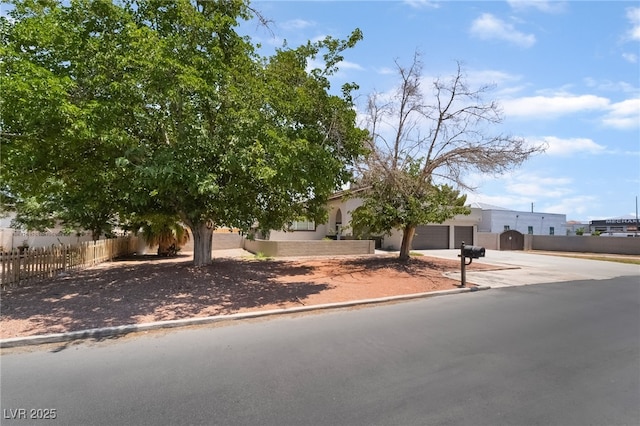 5676 Birchwood Cir, Las Vegas, NV 89120 - view of front of home with driveway, stucco siding, and an attached garage