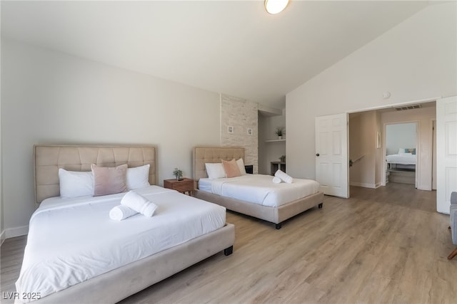 5676 Birchwood Cir, Las Vegas, NV 89120 - bedroom with light wood-style floors and high vaulted ceiling