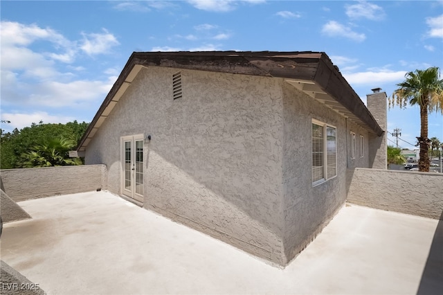 5676 Birchwood Cir, Las Vegas, NV 89120 - view of side of property with stucco siding, a balcony, and a patio