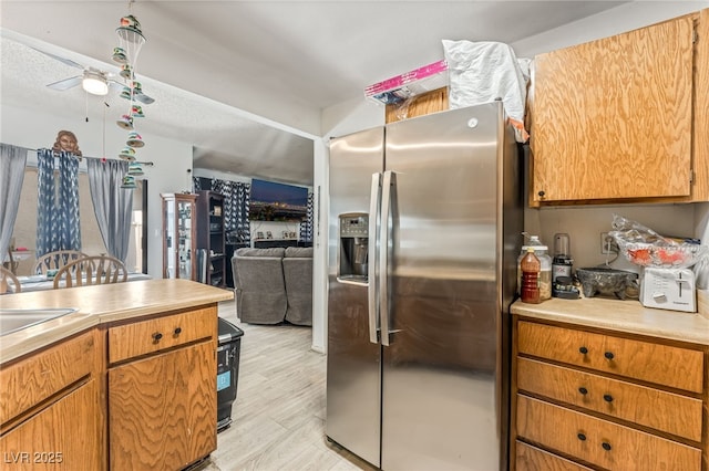 108 Sirnoble St, Las Vegas, NV 89110 - kitchen featuring stainless steel fridge with ice dispenser, light countertops, a ceiling fan, and open floor plan