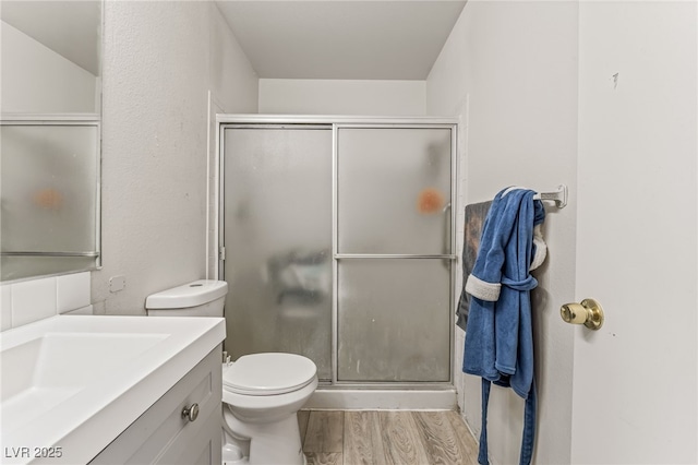 108 Sirnoble St, Las Vegas, NV 89110 - bathroom featuring wood finished floors, a shower stall, and vanity