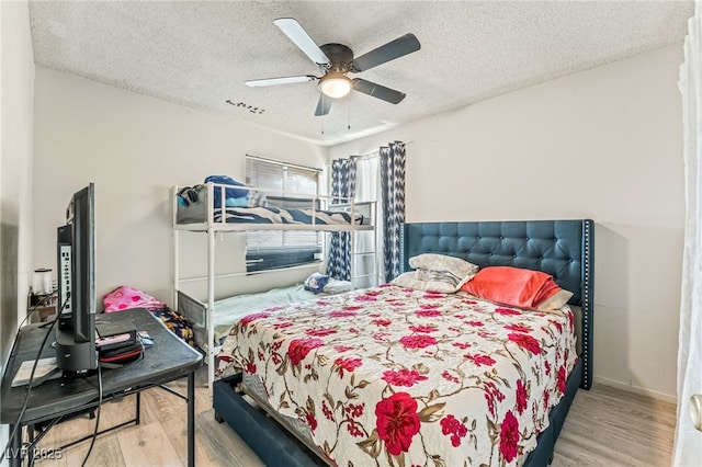 108 Sirnoble St, Las Vegas, NV 89110 - bedroom featuring wood finished floors, a textured ceiling, and a ceiling fan