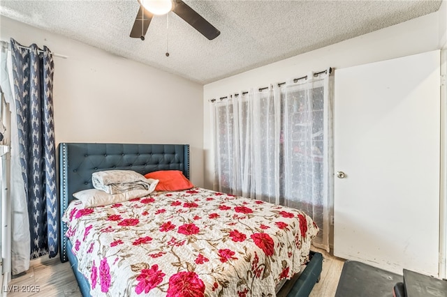 108 Sirnoble St, Las Vegas, NV 89110 - bedroom featuring a textured ceiling, wood finished floors, and a ceiling fan