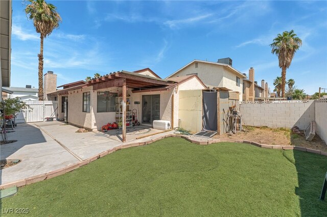 108 Sirnoble St, Las Vegas, NV 89110 - rear view of property featuring a patio area, stucco siding, and a fenced backyard