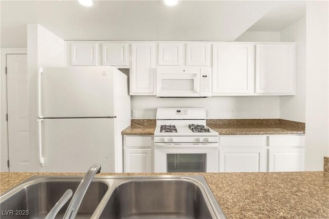 2801 N Rainbow Blvd Unit 235, Las Vegas, NV 89108 - kitchen featuring white appliances and white cabinetry
